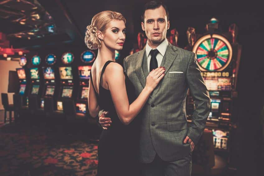 couple standing in front of slots