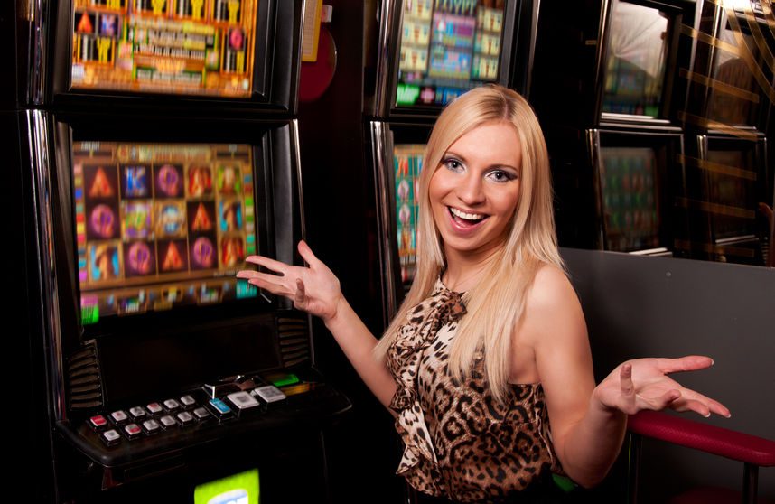 woman in front of slot machines